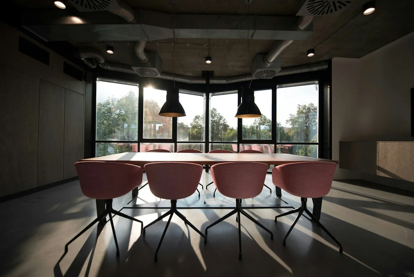 Daylit professional workspace and shared office tables; illustrative photography